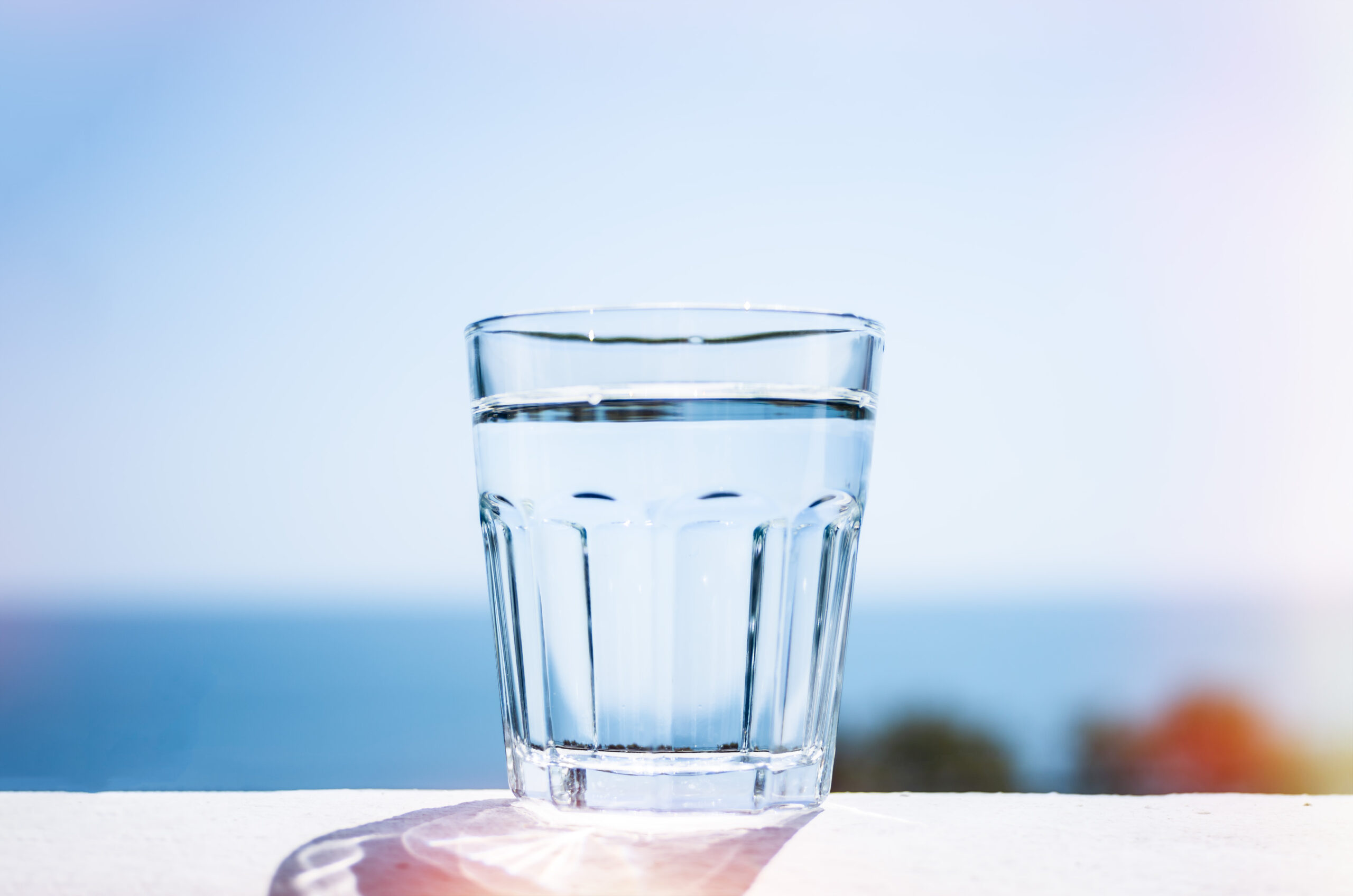 Clean water in a glass  Marine background  The concept of a healthy lifestyle 